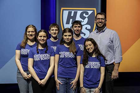 High school quiz show SHS contestants and coach Blake in the studio.