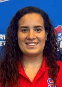 Headshot of Trainer Gabby, smiling in front of a background with the Somerville High School logo