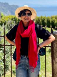 Photo of Ms. Sheikh in front of verdant landscape