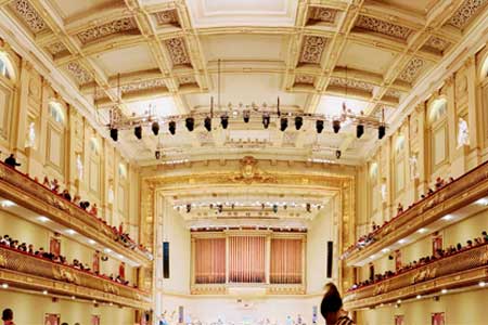Photo of Symphony Hall stage, balconies, and the stage from the audience