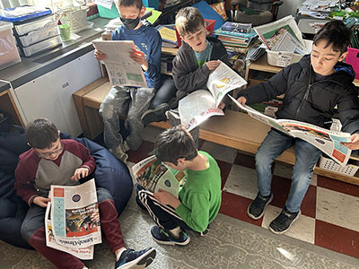 Kennedy students reading Kennedy Chronicle