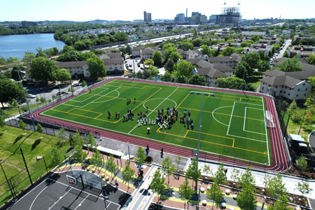 View from above of the Joe Mackey field at Healey School within surrounding neighborhood