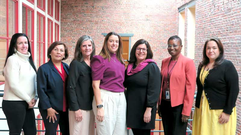 Photo of the enrollment office staff in an atrium