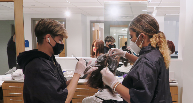 Cosmetology Students working together