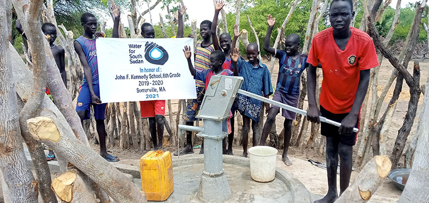Photo of Sudanese children at a well paid for partially by Kennedy School student fundraising