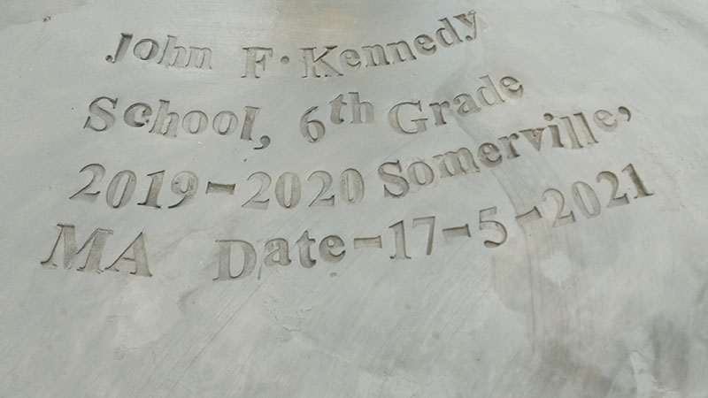 Photo of an inscription at a Sudanese well paid for partially by Kennedy School student fundraising