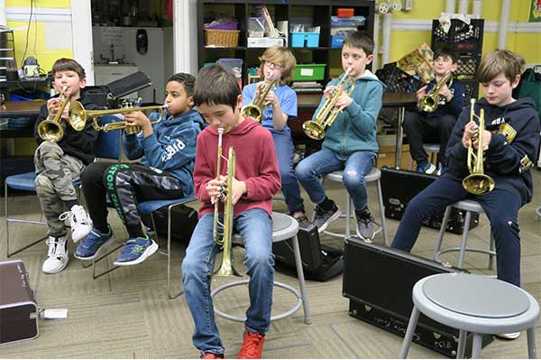 students playing band instruments
