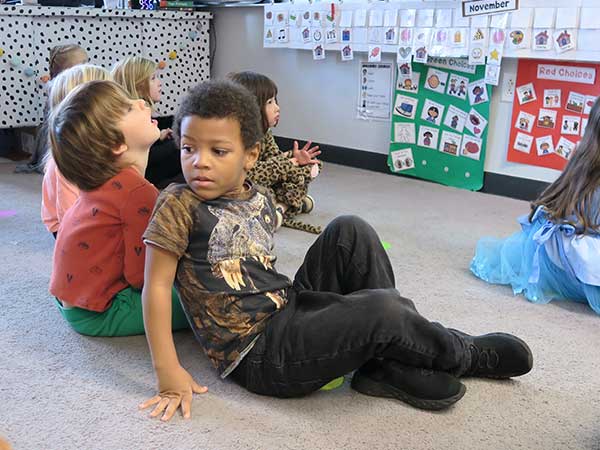Photo of prekindergarten students sitting for morning meeting.