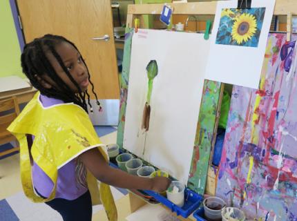 Summer Explore student paints 